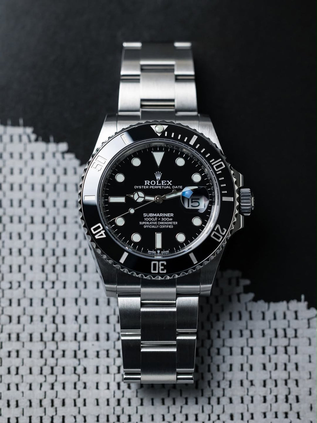 ROLEX SUBMARINE A BLACK DIAL AND BRUSHED STAINLESS STEEL OYSTER BRACELET AUTOMATIC WATCH